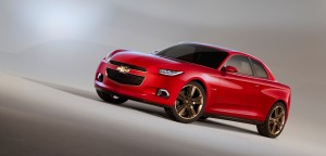 CODE 130R, one of Chevrolet's concept vehicles from the 2012 North American International Auto Show is a four-seat boxy coupe in red with matte gold wheels that represents ?functional muscle.? With an aggressive front fascia, Chevrolet fender flairs and straight body side, CODE 130R makes a unique and unapologetic style statement. The rear-wheel-drive coupe has a Chevy performance crossflag emblem on the body side to further illustrate its link to Chevrolet?s rich performance heritage.
